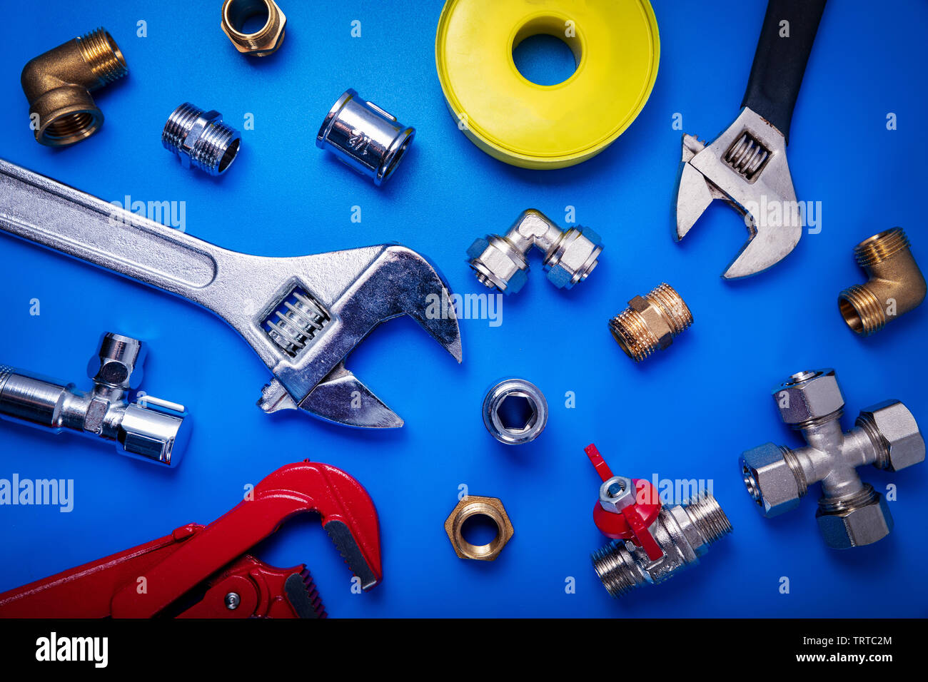 plumber equipment on blue background top view Stock Photo