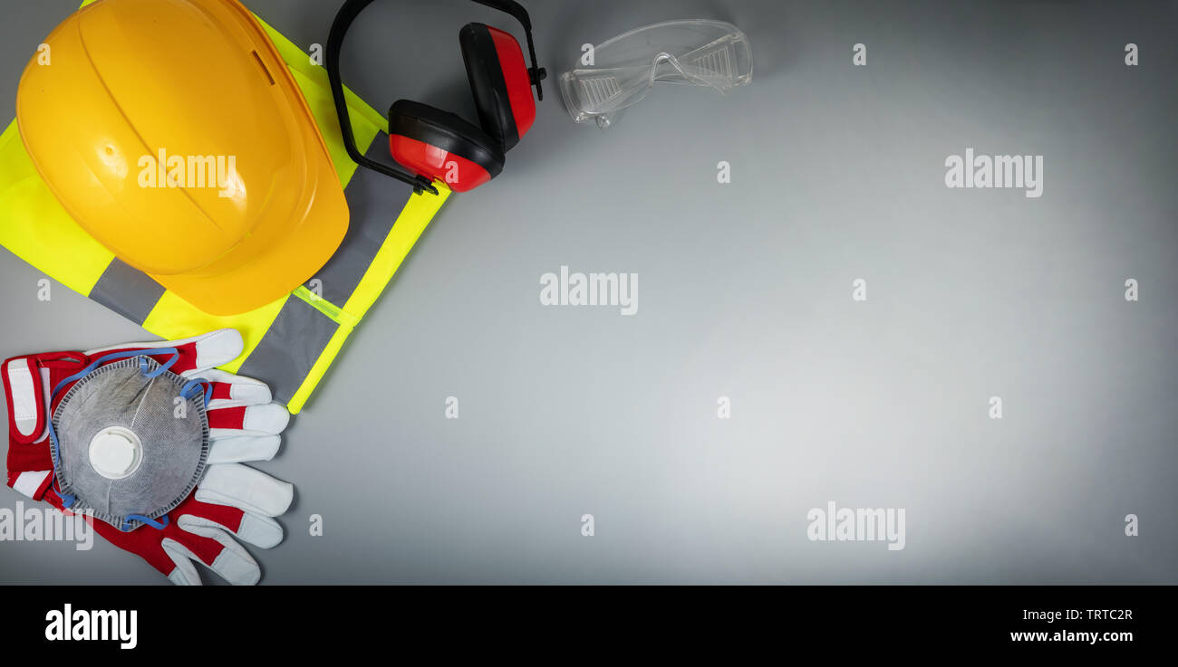 work safety items of construction industry on gray background with copy space Stock Photo