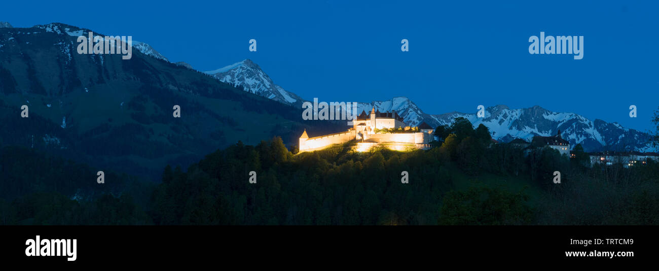 Gruyere, VD / Switzerland - 31 May 2019: panorama view the historic castle at Gruyere with mountain landscape at twilight Stock Photo