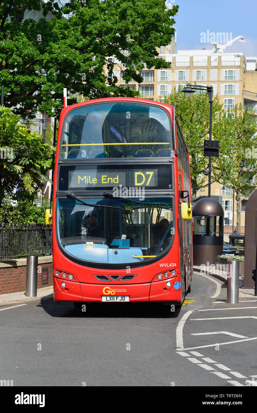 Red double Deck bus entering the Canary Wharf estate , Docklands, London, United Kingdom Stock Photo