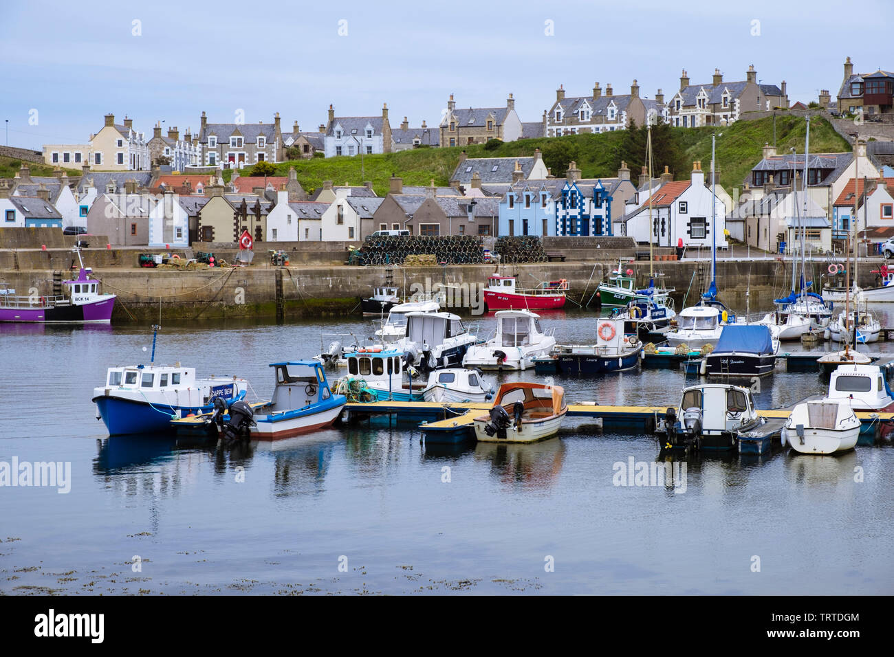 Boats moored in harbour of fishing village on Moray Firth coast. Findochty, Morayshire, Scotland, UK, Britain Stock Photo