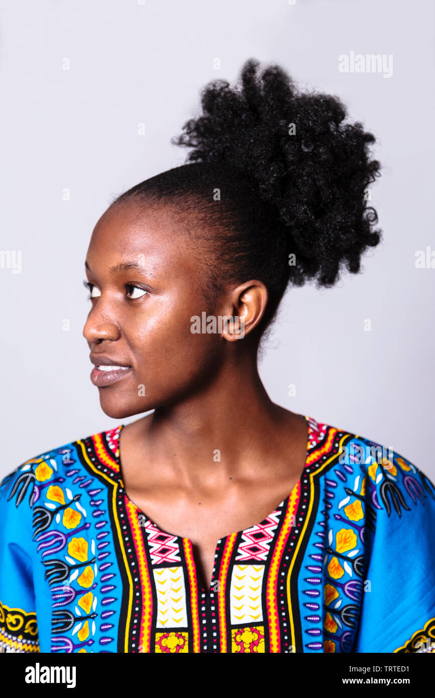 Young south african zulu or maasai woman in traditional clothes in studio Stock Photo