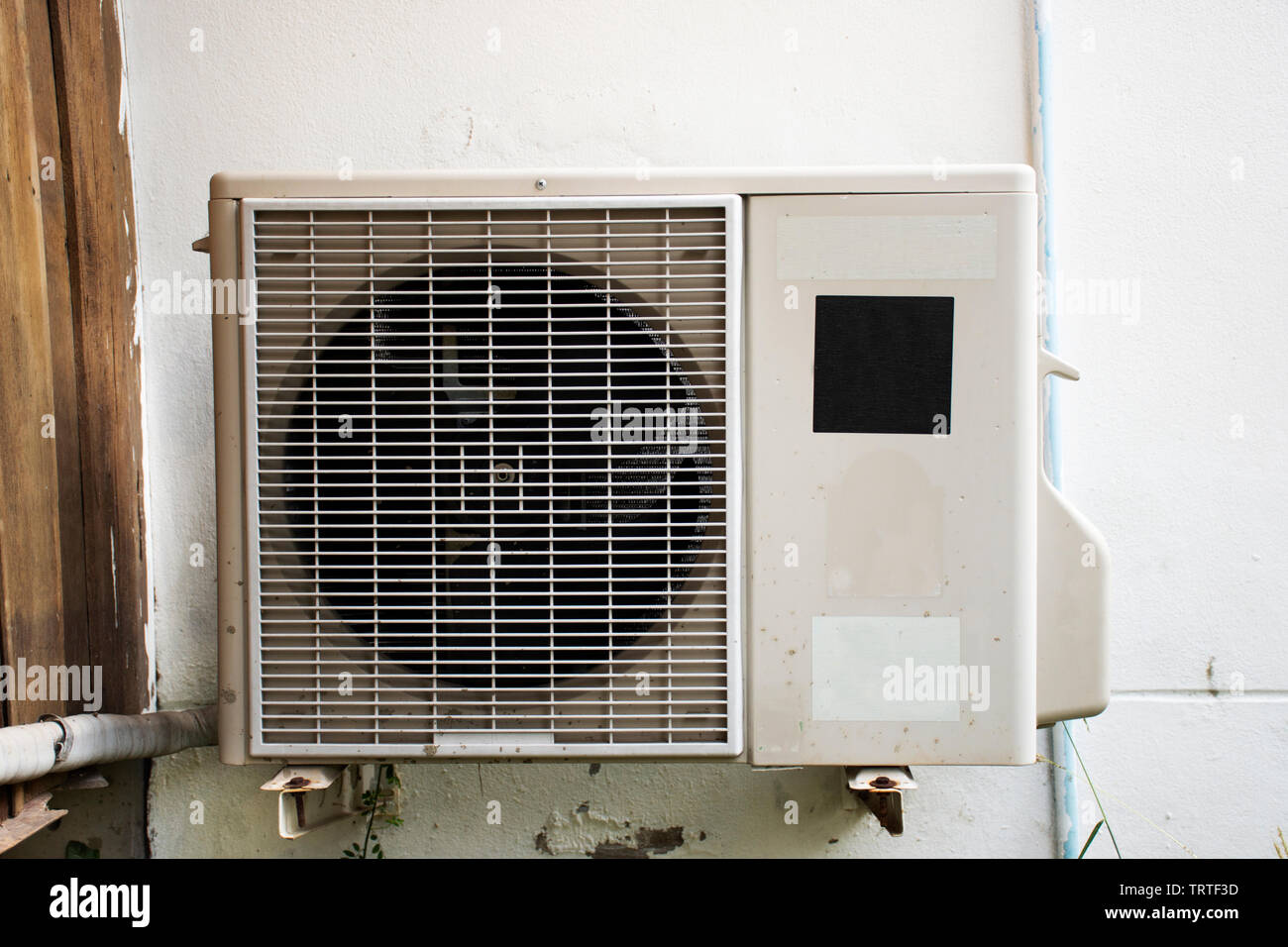 Evaporator Coil & Condenser Coils of air conditioner at outside of house in Thailand Stock Photo