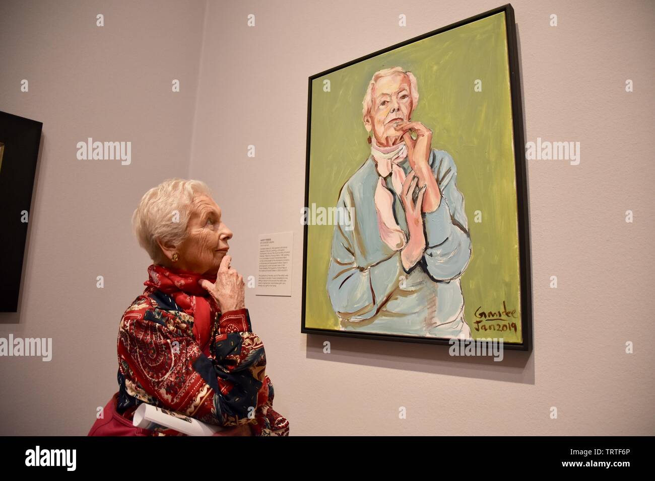 London, UK. Model Theresa gazes at Aunty Theresa by Gandee Vasan. BP Portrait Award 2019 Press Day, The exhibition runs from 13 June to 20 October 2019. National Portrait Gallery, St Martin's Place, London. UK Credit: michael melia/Alamy Live News Stock Photo