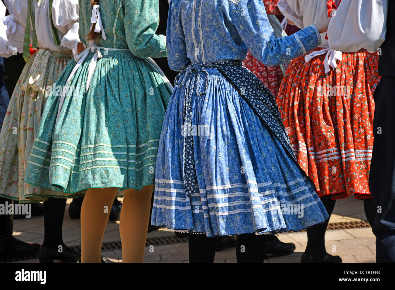 Folk dancers in traditional clothing Stock Photo