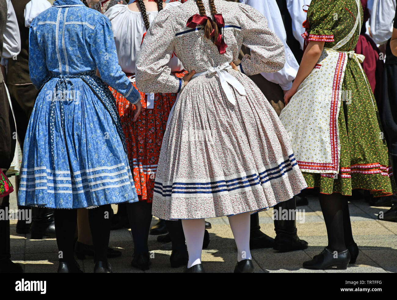 Folk dancers in traditional clothing Stock Photo
