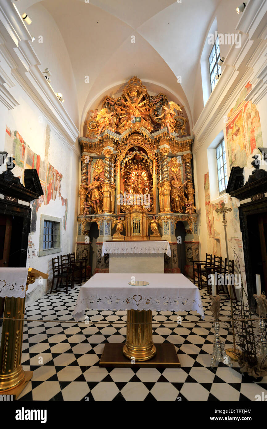 Interior of the Assumption of Mary Pilgrimage Church on Bled Island, Slovenia, showing the altar and frescoes.
