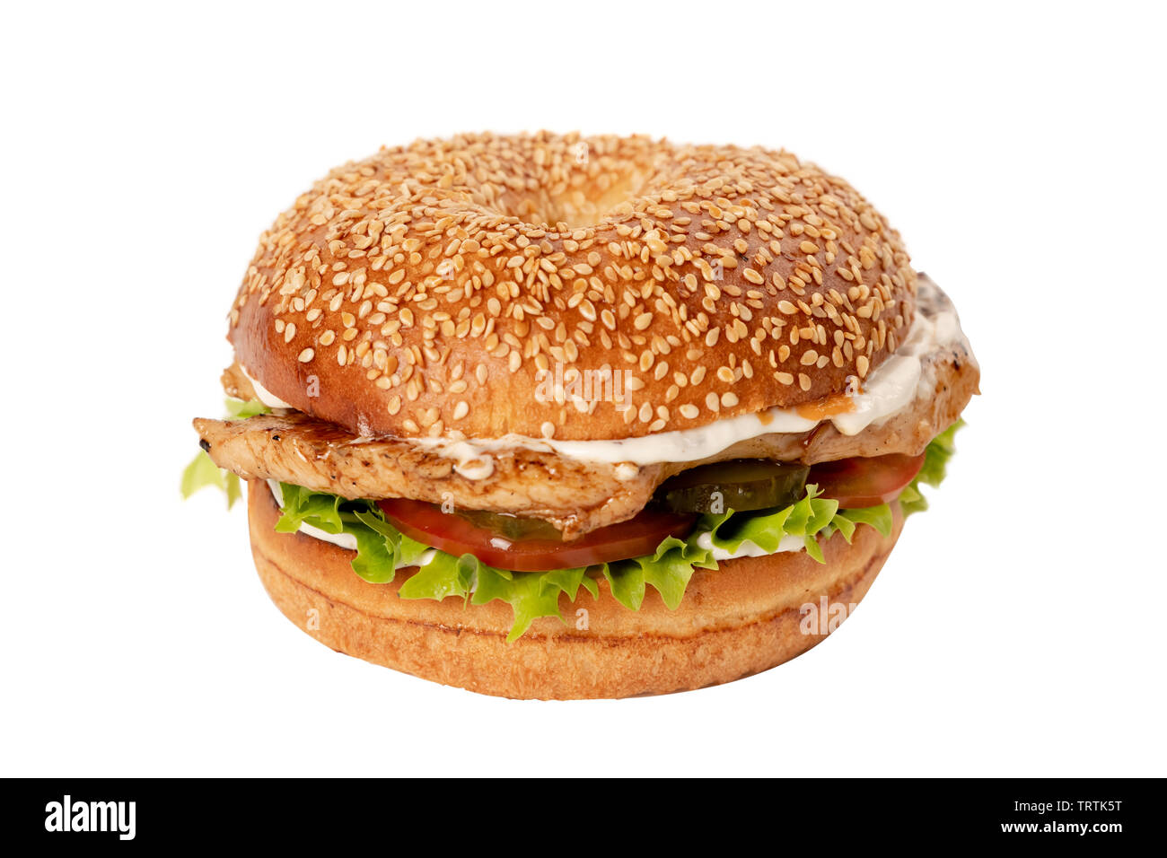 Juicy Burger on white isolated background. Bun with sesame seeds. The theme of eating fast food Stock Photo