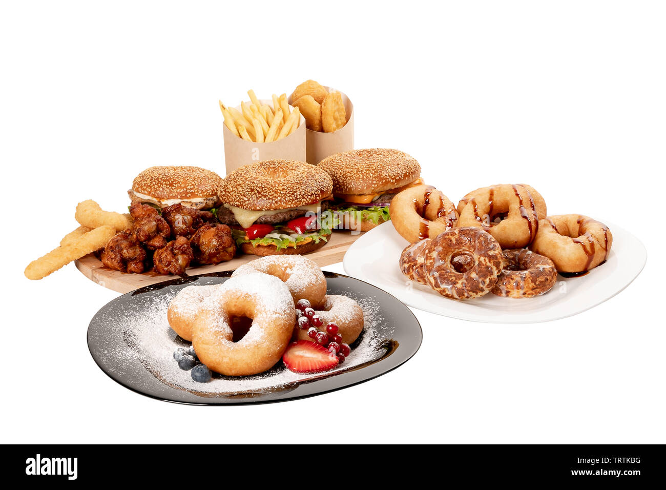 ingredients hamburger, French fries, donuts, nuggets, cheese sticks and chicken legs on white isolated background, concept Stock Photo