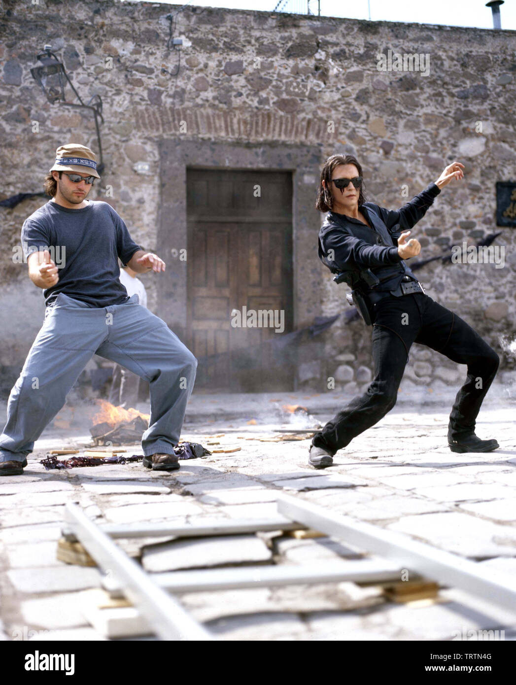 ROBERT RODRIGUEZ and JOHNNY in ONCE UPON A TIME IN MEXICO (2003). Copyright: use only. No merchandising or This is a publicly distributed handout. Access rights only, no