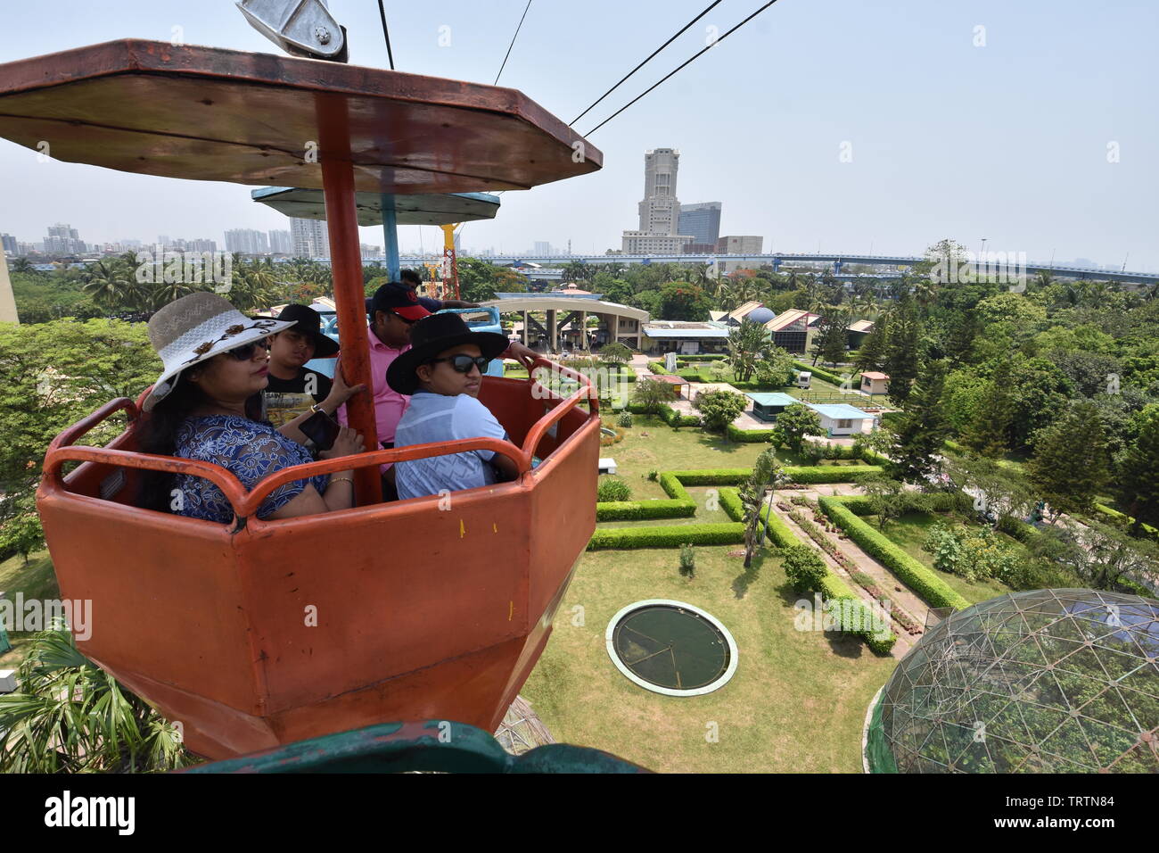 Overhead ropeway with buckets carrying visitors at the Science City ...