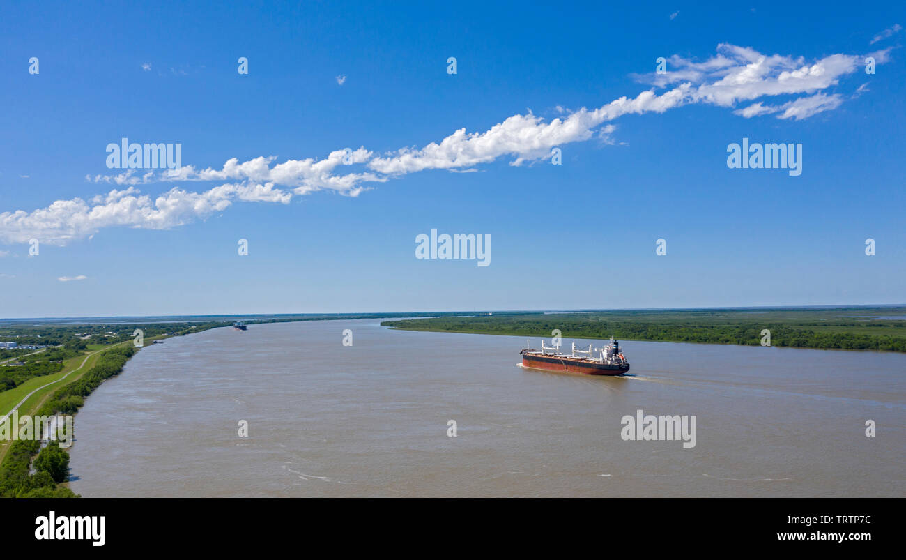 Empire, Louisiana - The Greek bulk carrier Doric Victory sails towards New Orleans on the Mississippi River near the Gulf of Mexico. Stock Photo