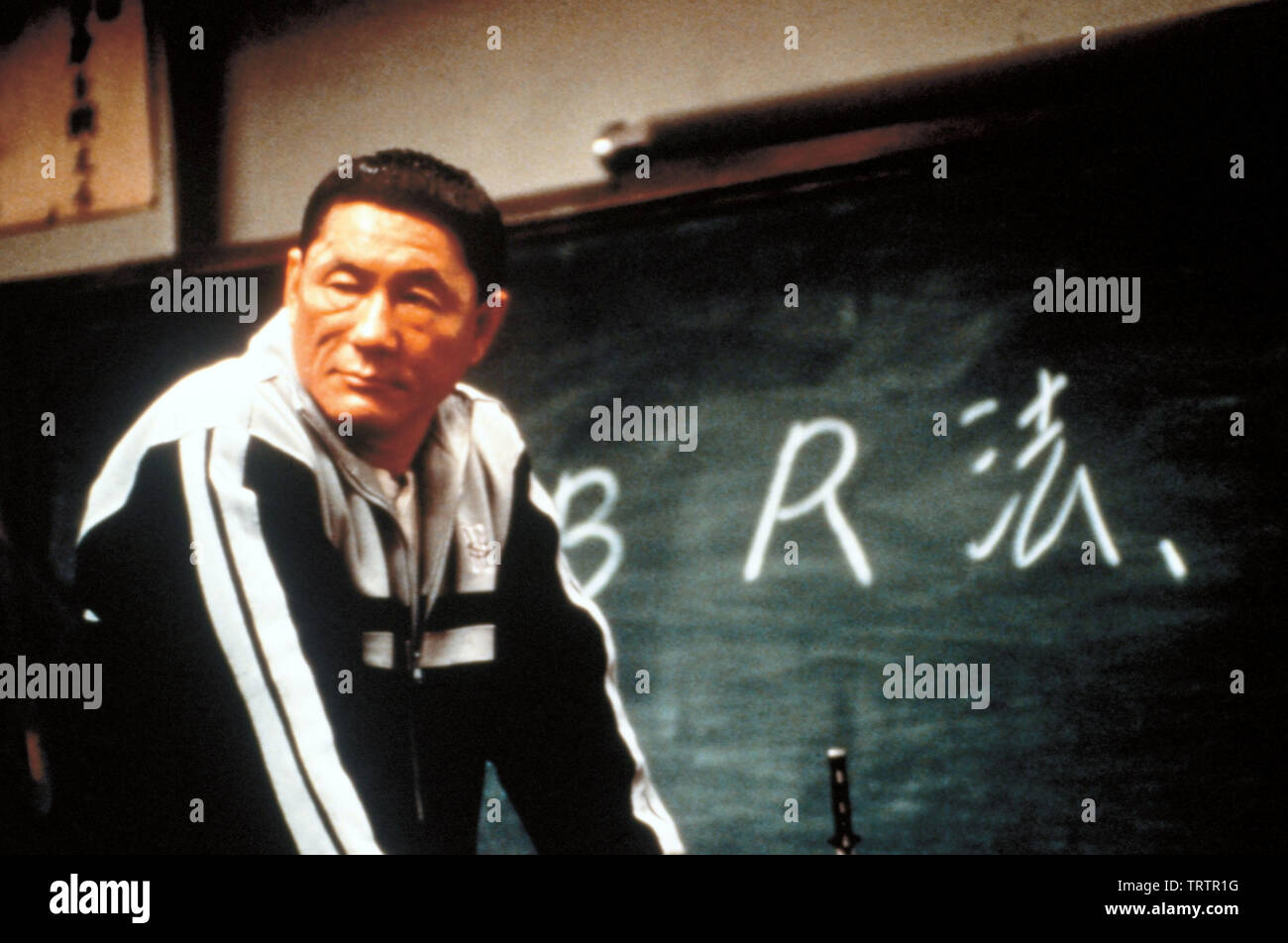 TAKESHI KITANO in BATTLE ROYALE (2000) -Original title: BATORU ROWAIARU-. Copyright: Editorial use only. No merchandising or book covers. This is a publicly distributed handout. Access rights only, no license of copyright provided. Only to be reproduced in conjunction with promotion of this film. Credit: BATTLE ROYALE PRODUCTION COMMITTEE / Album Stock Photo