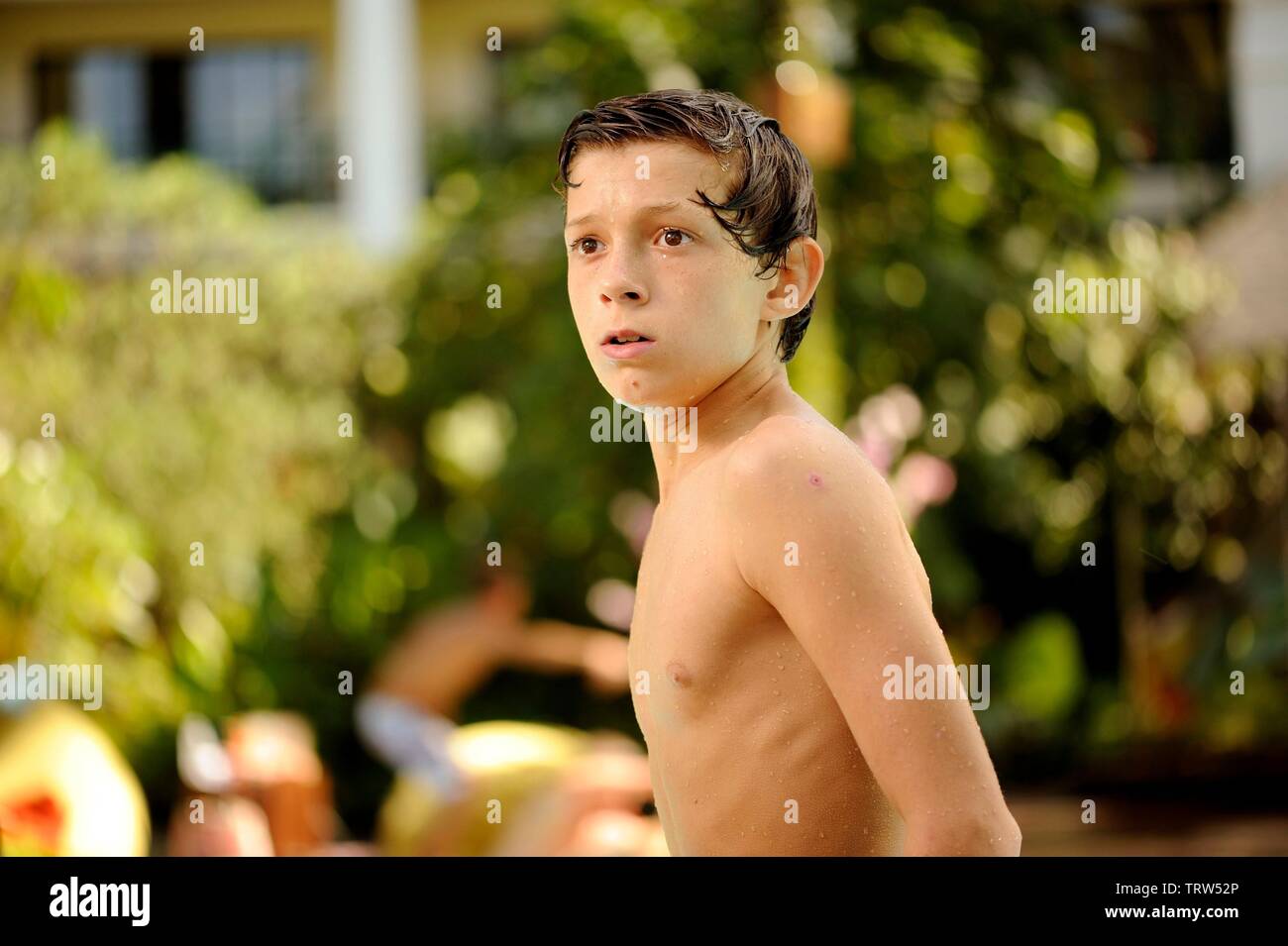 TOM HOLLAND in THE IMPOSSIBLE (2012). Copyright: Editorial use only. No merchandising or book covers. This is a publicly distributed handout. Access rights only, no license of copyright provided. Only to be reproduced in conjunction with promotion of this film. Credit: APACHES ENTERTAINMENT / Album Stock Photo