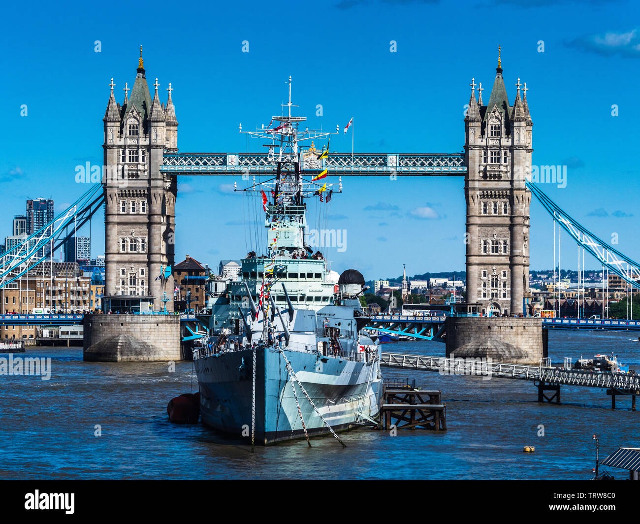 HMS Belfast in front of Tower Bridge - London Tourism Stock Photo