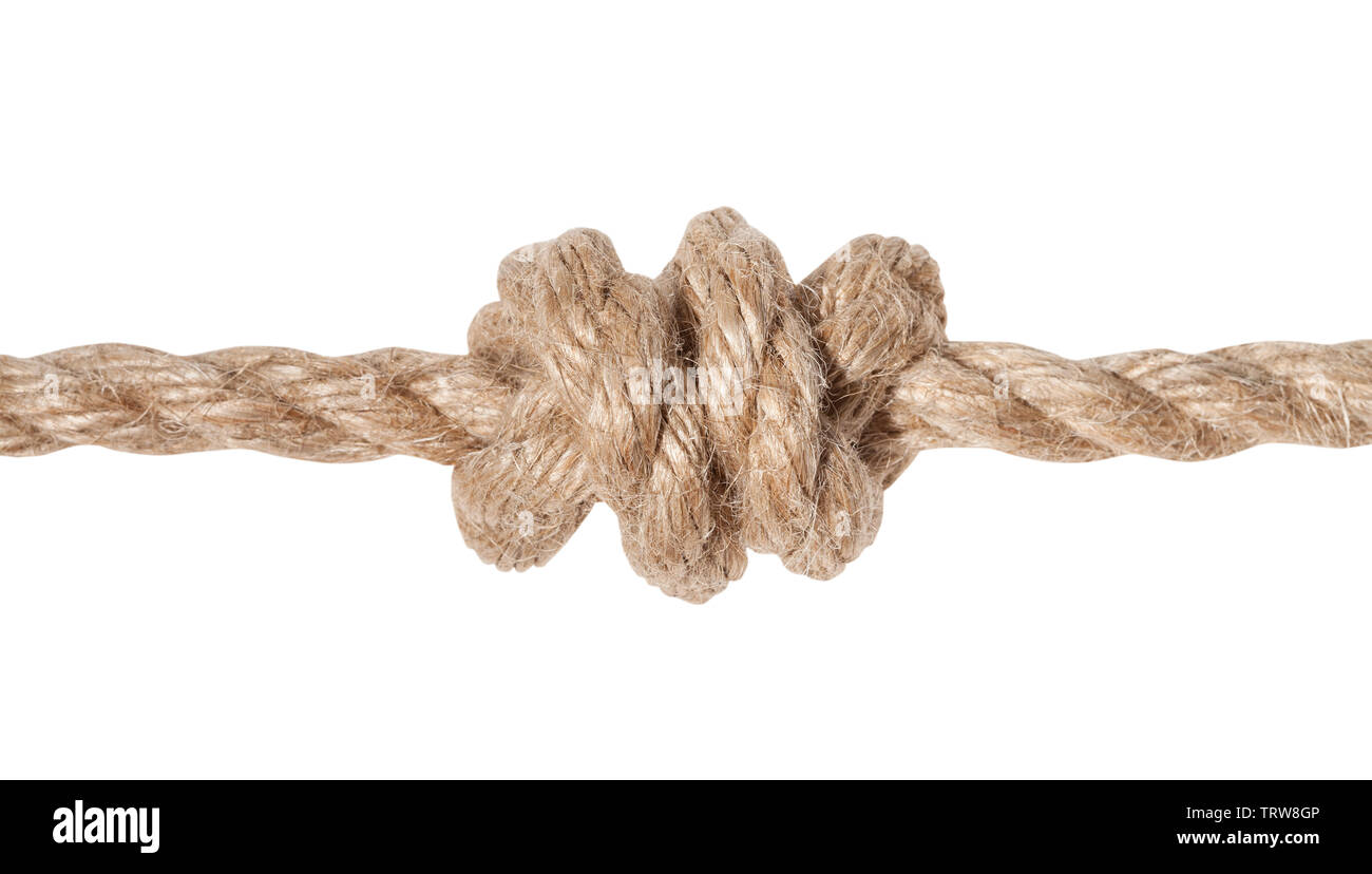 double overhand knot tied on thick jute rope isolated on white background Stock Photo