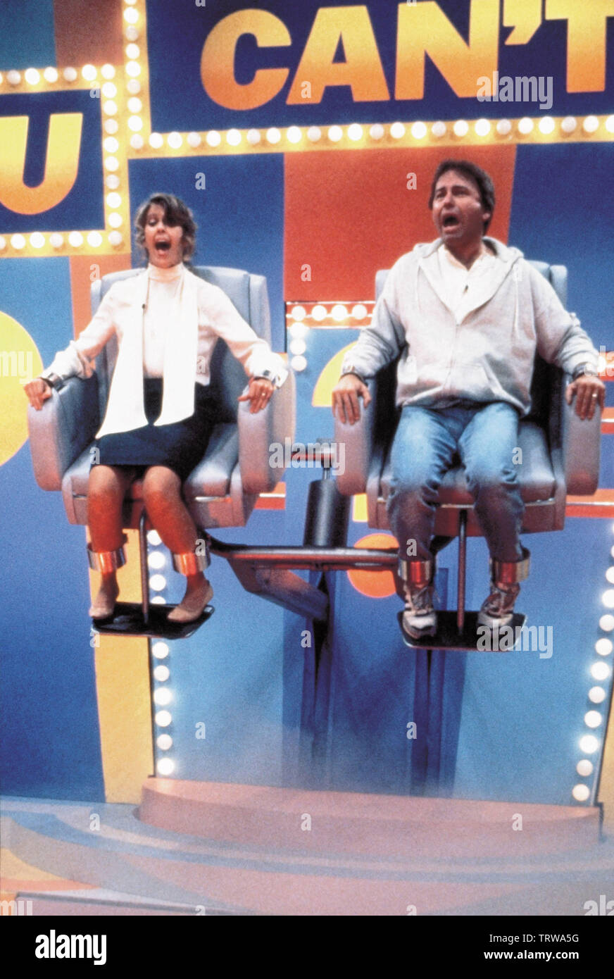 JOHN RITTER and PAM DAWBER in STAY TUNED (1992). Copyright: Editorial use only. No merchandising or book covers. This is a publicly distributed handout. Access rights only, no license of copyright provided. Only to be reproduced in conjunction with promotion of this film. Credit: MORGAN CREEK/WARNER BROS / AKESTER, BOB / Album Stock Photo