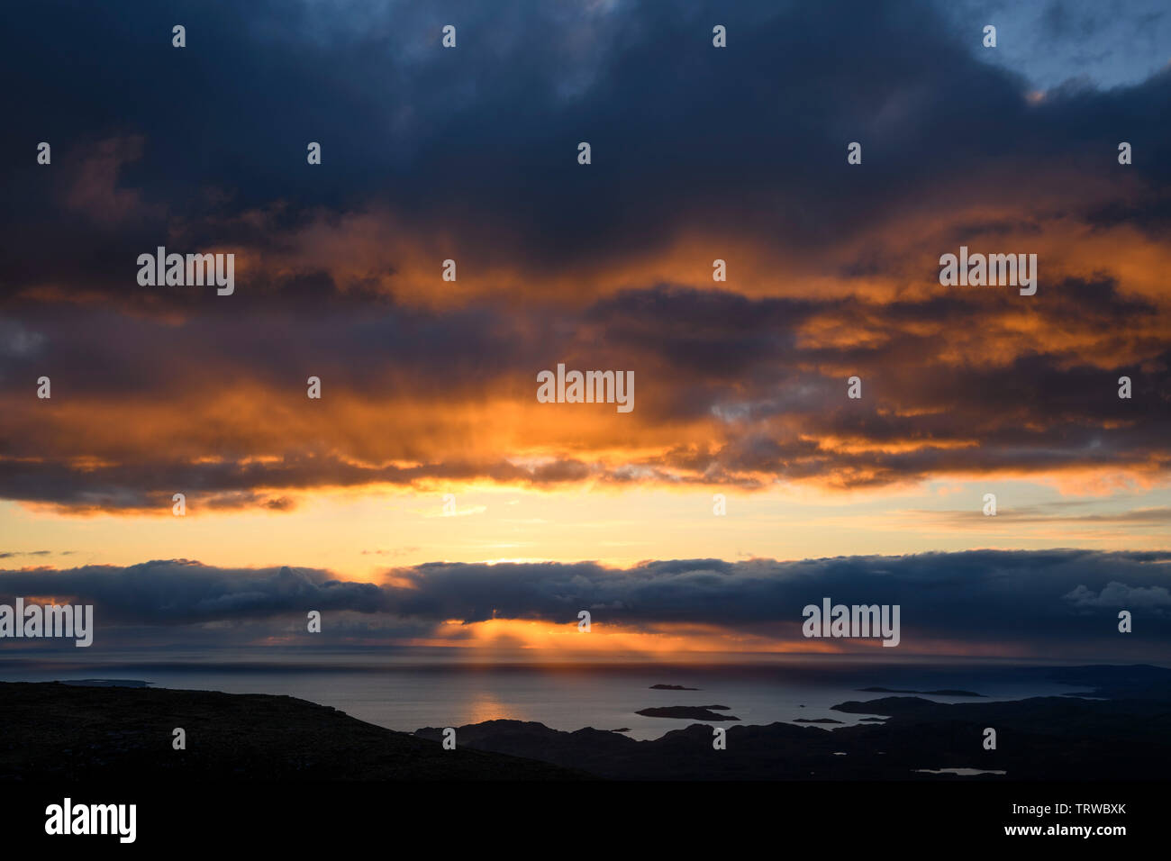 Sunset view from Stac Pollaidh, Coigach peninsula, Wester Ross, Highlands, Scotland Stock Photo