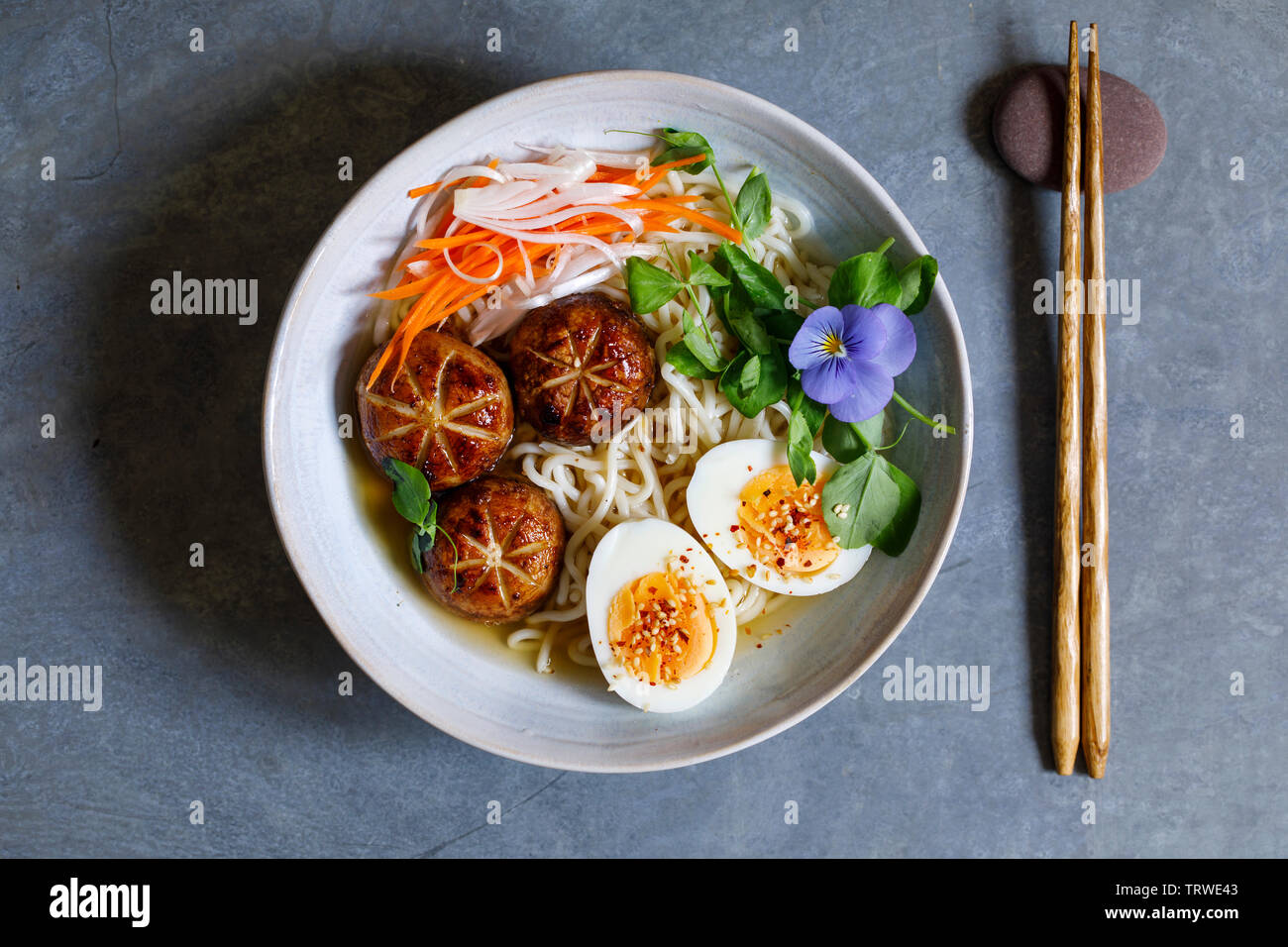 Japanese miso ramen with stuffed mushrooms, noodles and egg Stock Photo