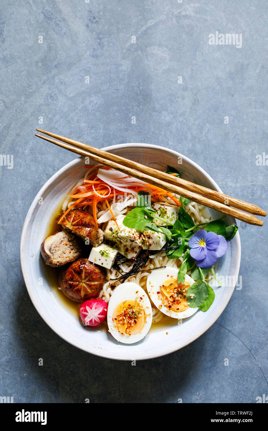 Japanese miso ramen with stuffed mushrooms, noodles and egg Stock Photo