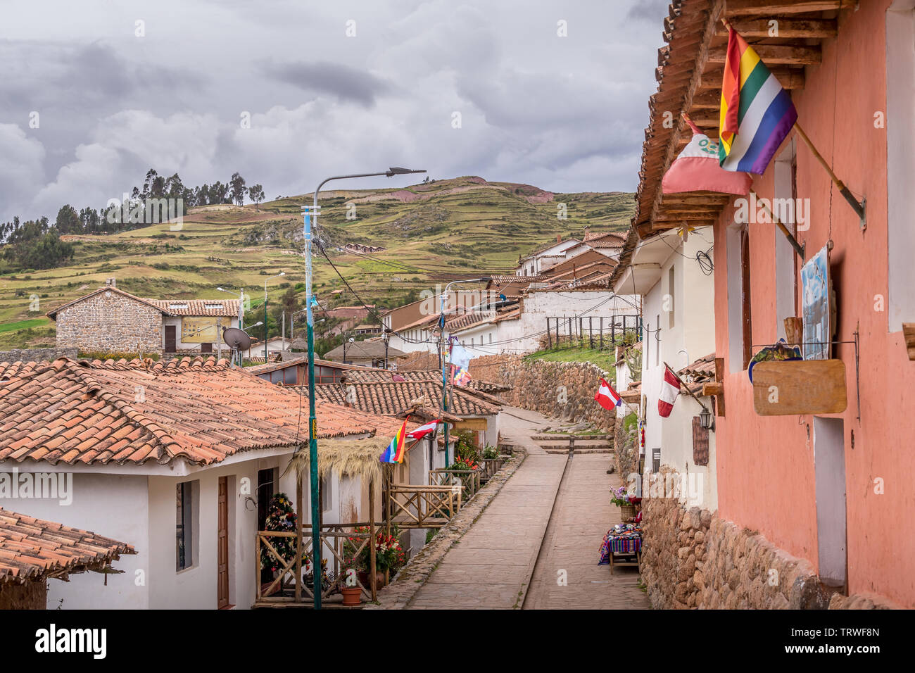 Hillside street of Cuzco, Peru with mountain in the background Stock Photo