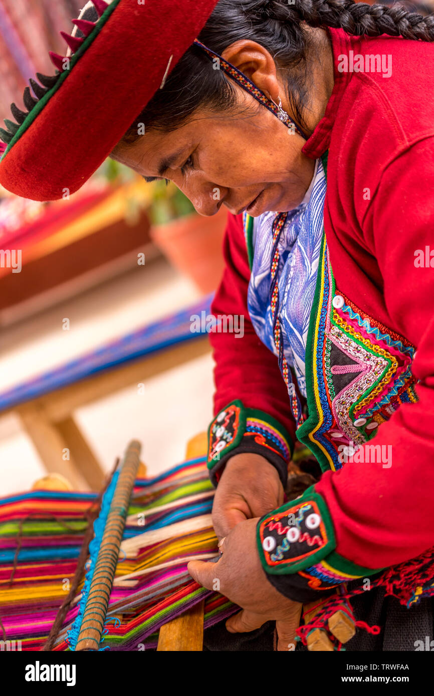 Cuzco, Peru - April 30, 2019. Peruvian woman working on traditional handmade wool production Stock Photo