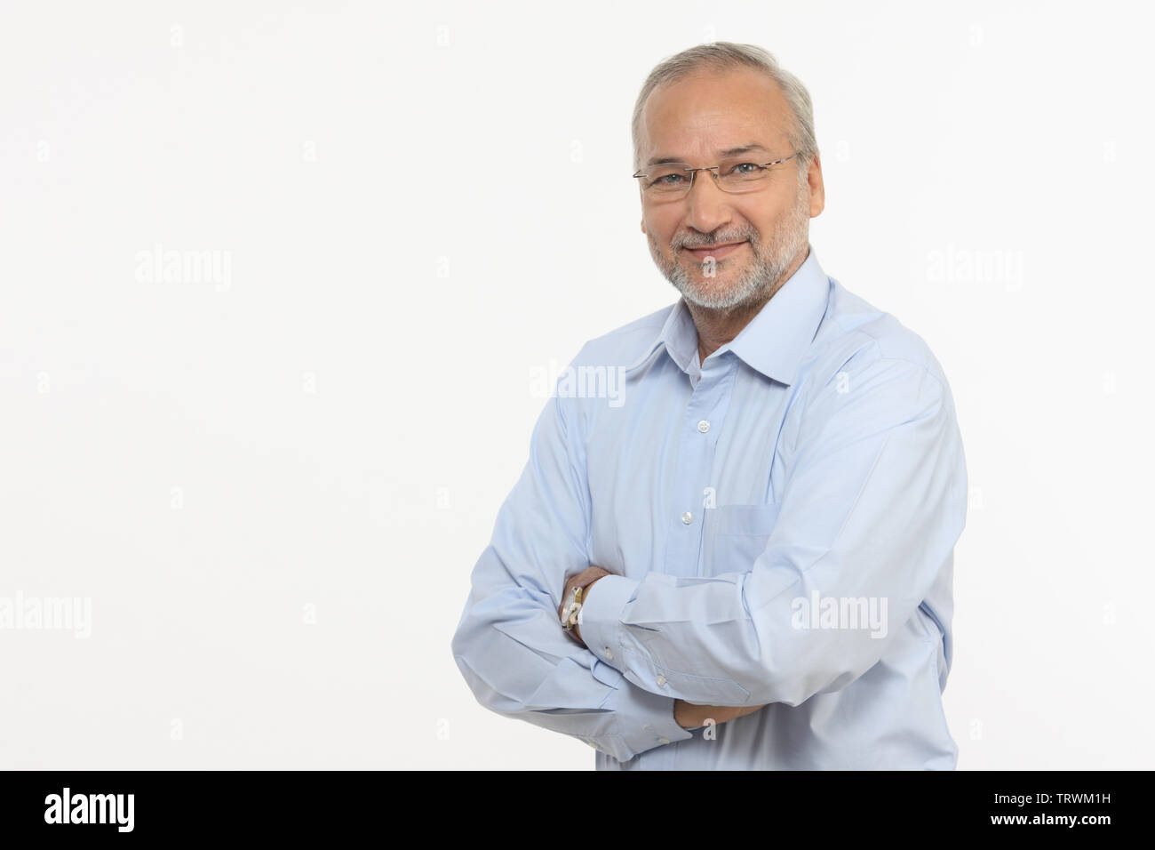 Portrait of a man smiling with arms crossed Stock Photo - Alamy