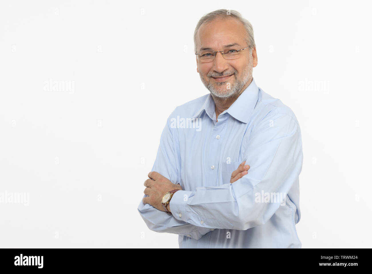 Portrait of a man smiling with arms crossed Stock Photo - Alamy