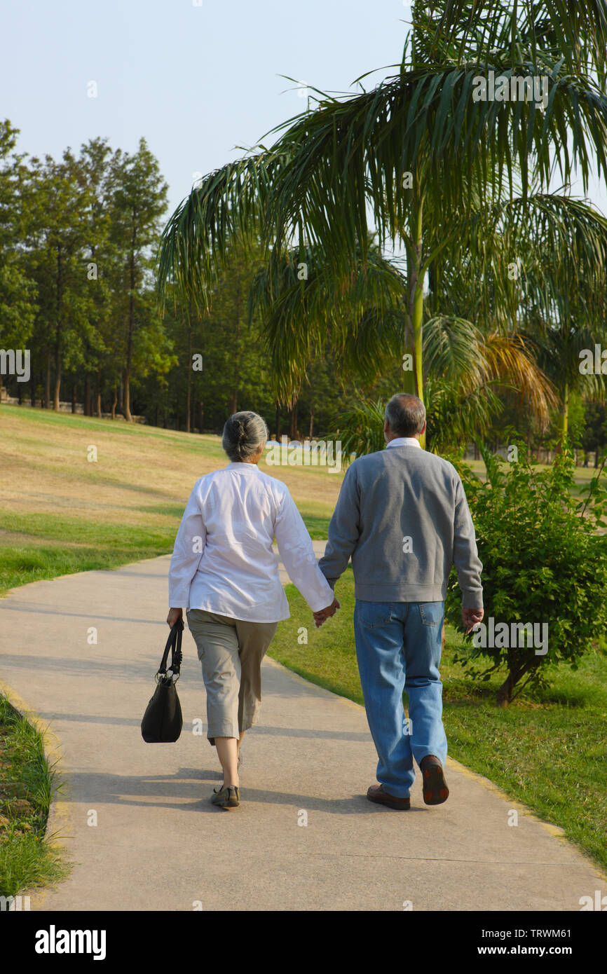 Old indian couples walking in the park hi-res stock photography and ...