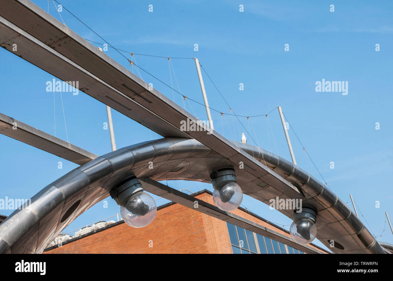 Stainless steel archways with overhead projection lighting units on