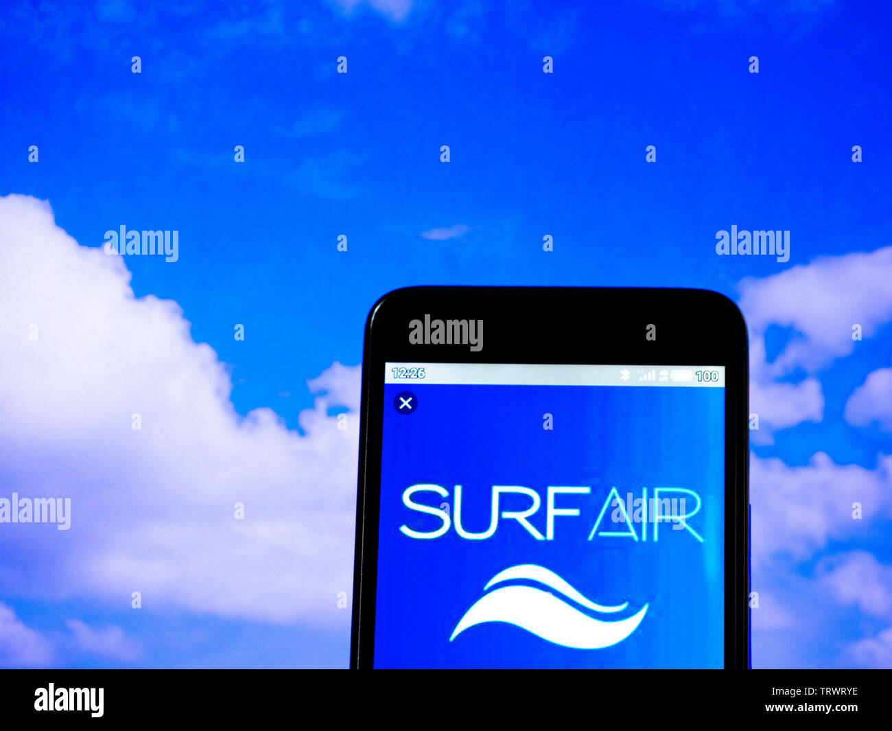 In this photo illustration the Surf Air logo is seen displayed on a