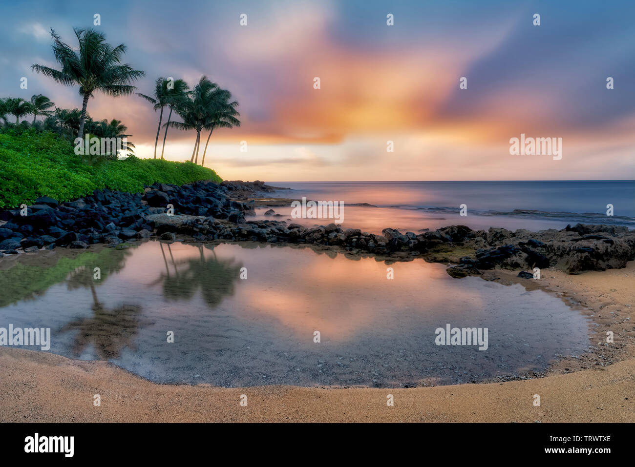 Reflecting pool and sunrise., Keiki Cove. Poipu, Kauai, Hawaii Stock ...