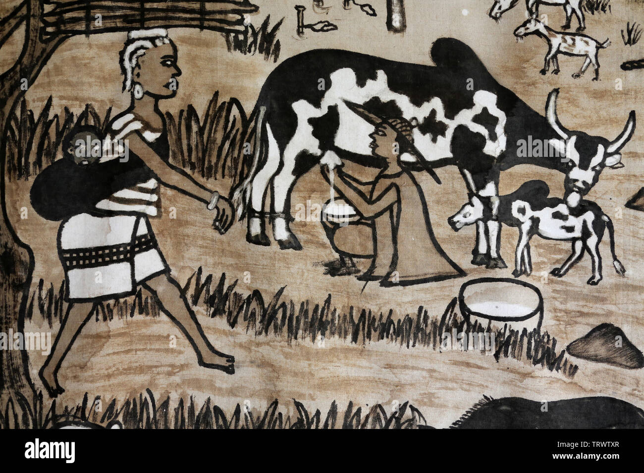 Traite d'une vache. Musée International du Golfe de Guinée. Lomé. Togo. Afrique de l'Ouest. Stock Photo