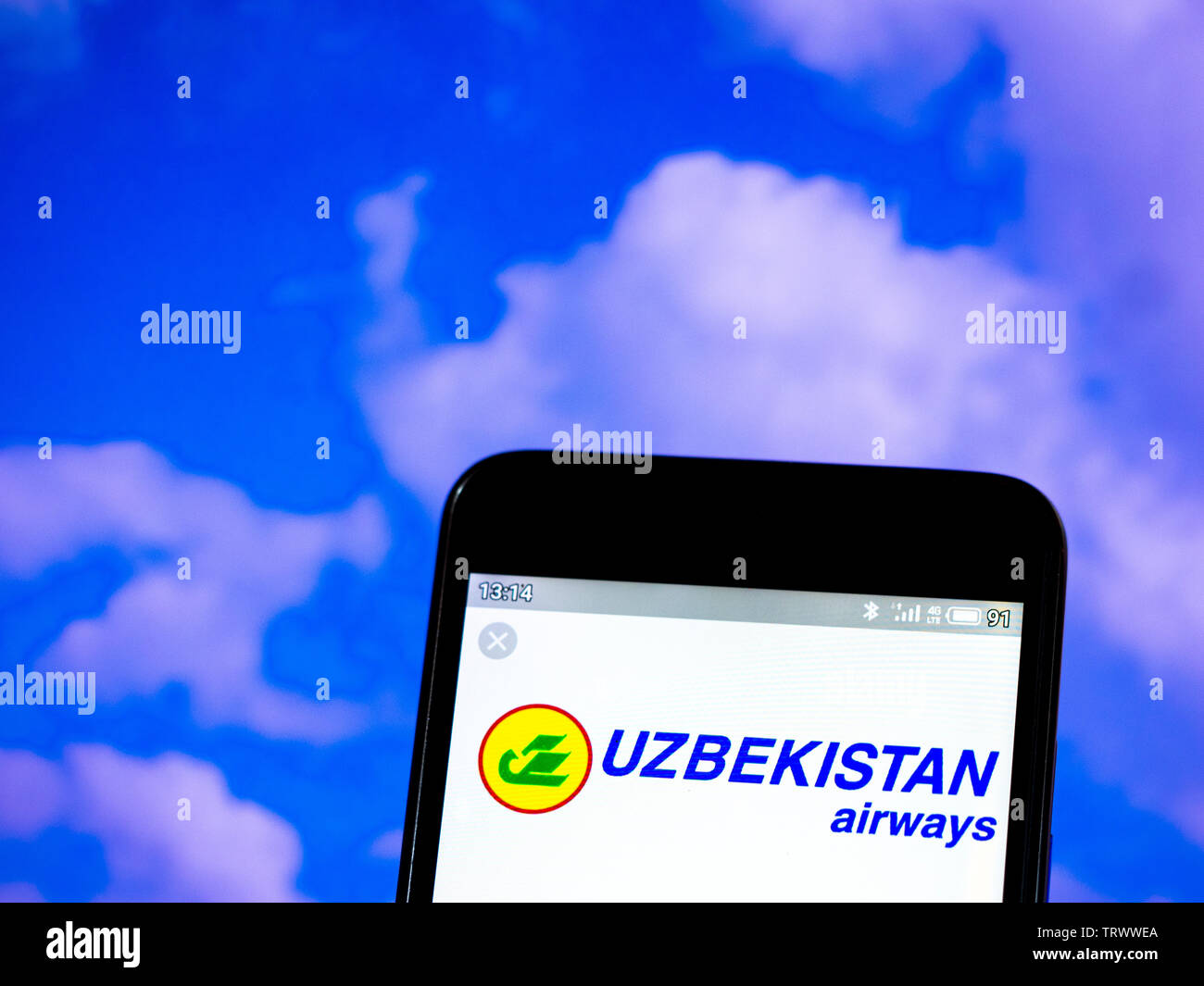In this photo illustration the Uzbekistan Airways logo is seen displayed on a smartphone Stock Photo