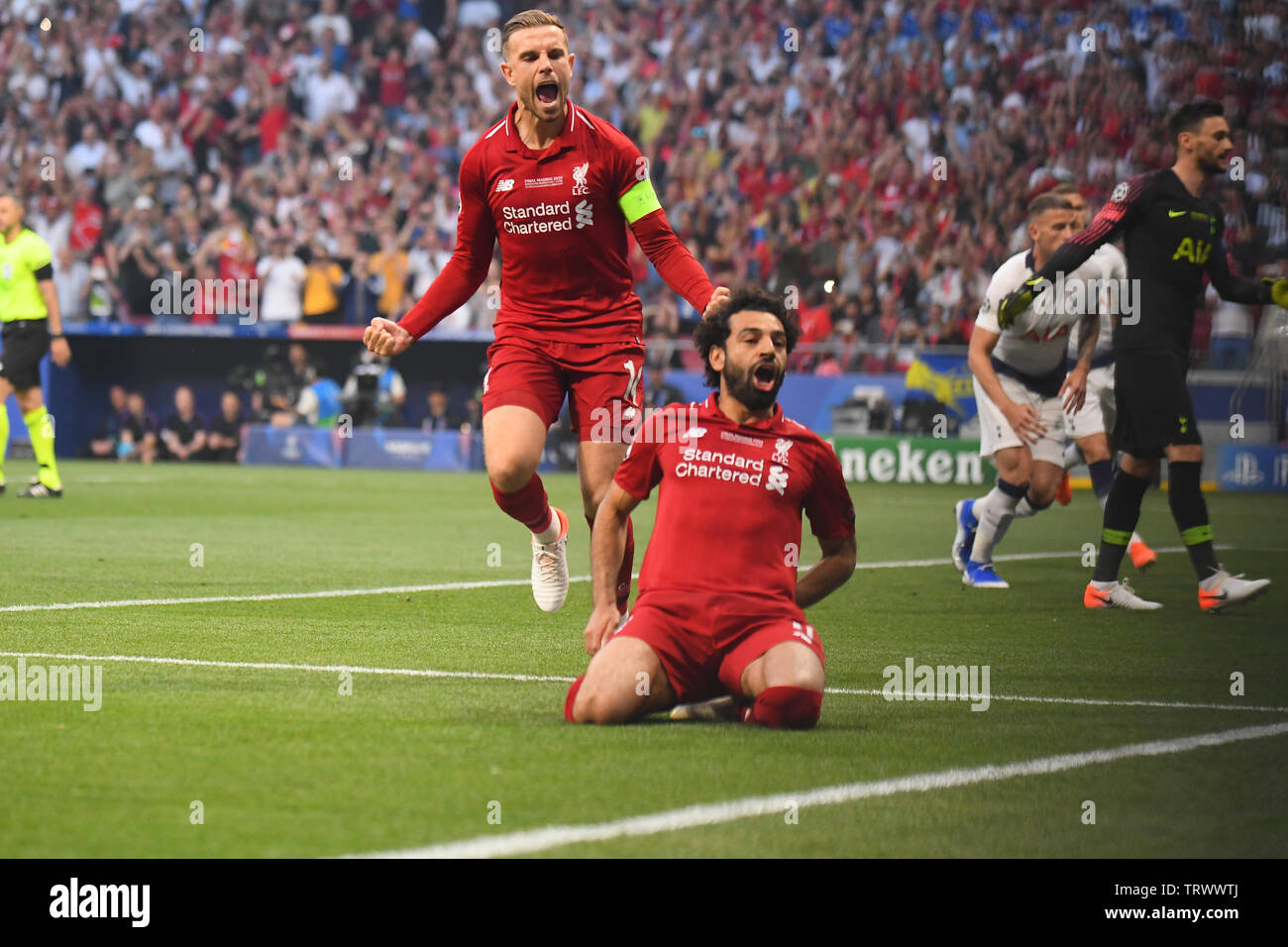 MADRID, SPAIN - JUNE 1, 2019: Mohamed Salah of Liverpool celebrates with Jordan Henderson of Liverpool after he scored during the 2018/19 UEFA Champions League Final between Tottenham Hotspur (England) and Liverpool FC (England) at Wanda Metropolitano. Stock Photo