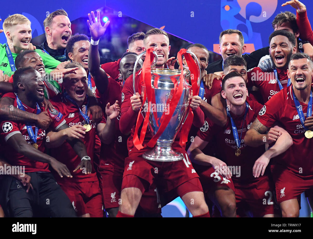 MADRID, SPAIN - JUNE 1, 2019: Jordan Henderson of Liverpool lifts the trophy during the award ceremony held after the 2018/19 UEFA Champions League Final between Tottenham Hotspur (England) and Liverpool FC (England) at Wanda Metropolitano. Stock Photo
