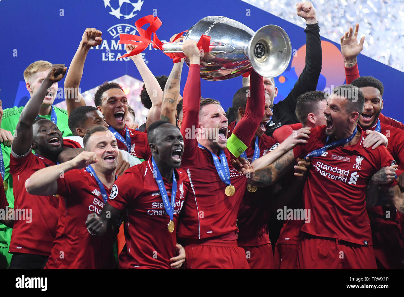 MADRID, SPAIN - JUNE 1, 2019: Jordan Henderson of Liverpool lifts the trophy during the award ceremony held after the 2018/19 UEFA Champions League Final between Tottenham Hotspur (England) and Liverpool FC (England) at Wanda Metropolitano. Stock Photo