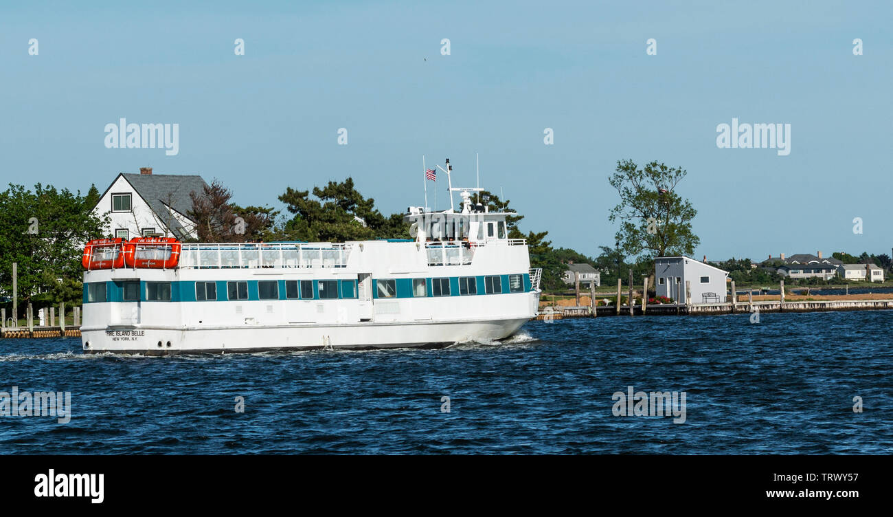 Bay Shore, New York, USA 8 June 2019 A ferry boat heading out of Bay Shore with a few people