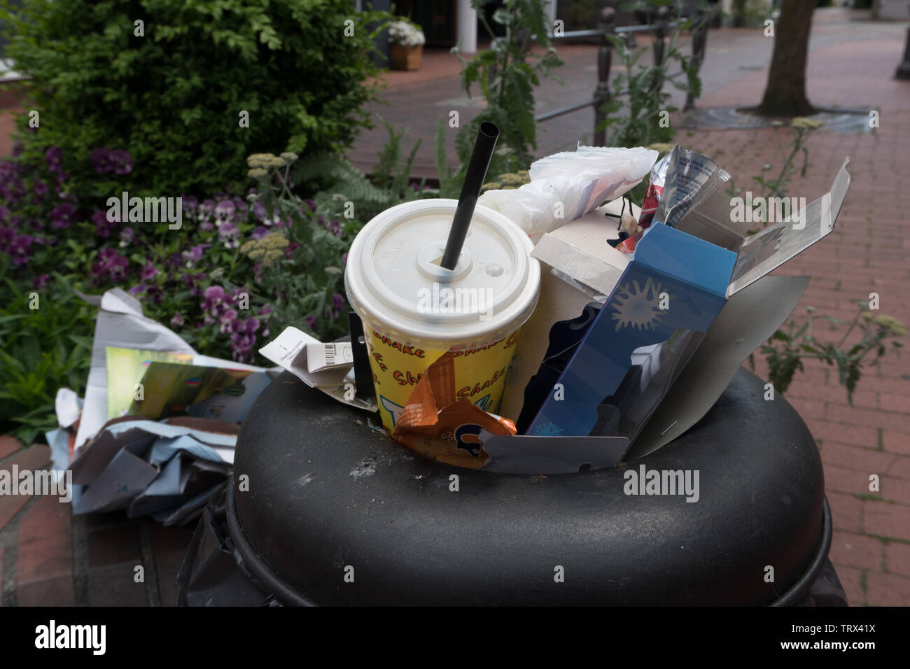 Rubbish in overflowing public bin. Wittmund. East Frisia. Germany Stock Photo