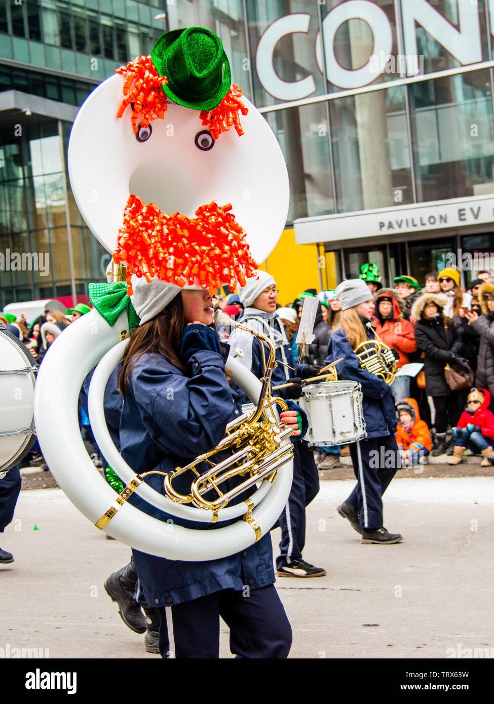 Dressed up marching band celebrating Saint Patricks Day in downtown Montreal Stock Photo