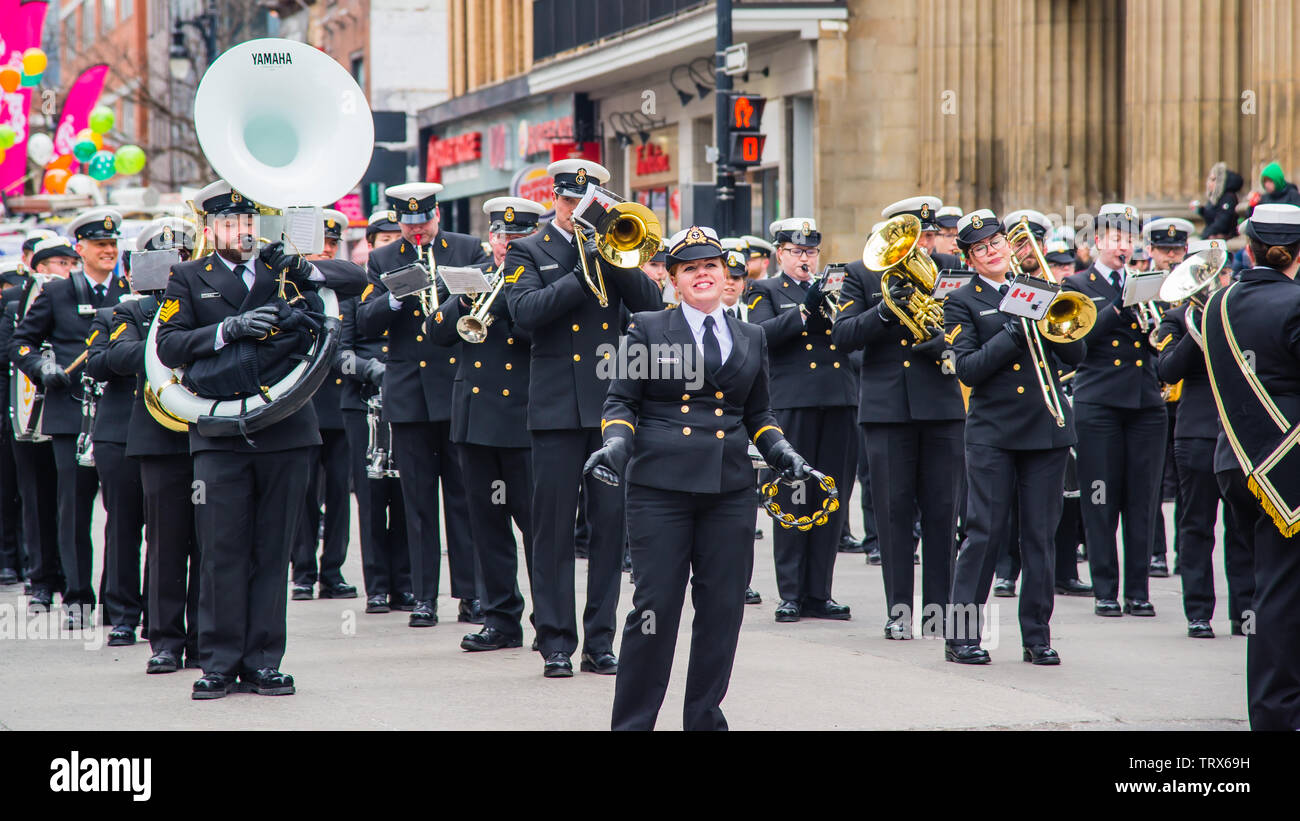 Marching band with uniform parading in the Saint Patrick Day in Montreal downtown Stock Photo