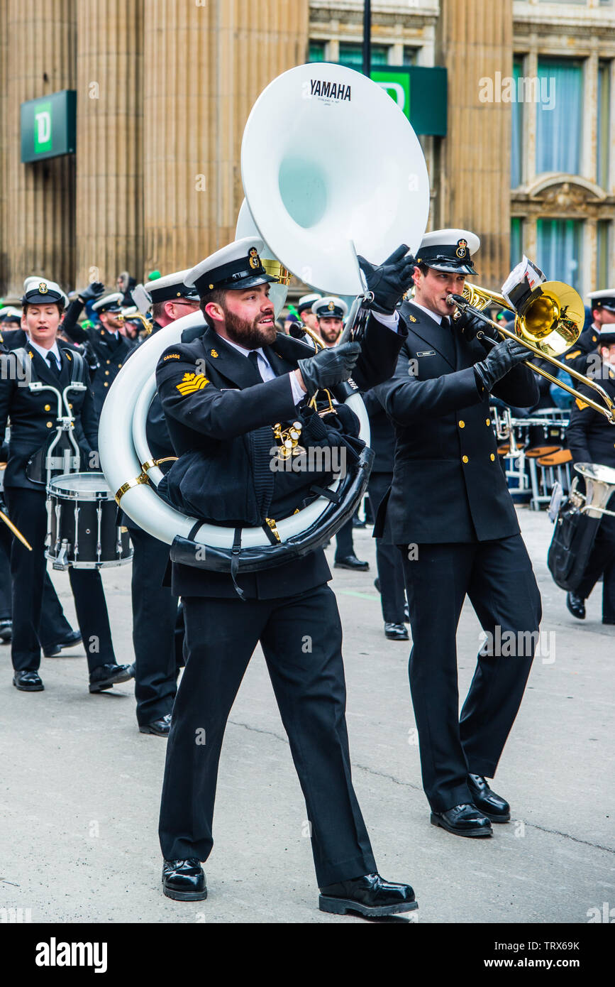 Marching band with uniform parading in the Saint Patrick Day in Montreal downtown Stock Photo