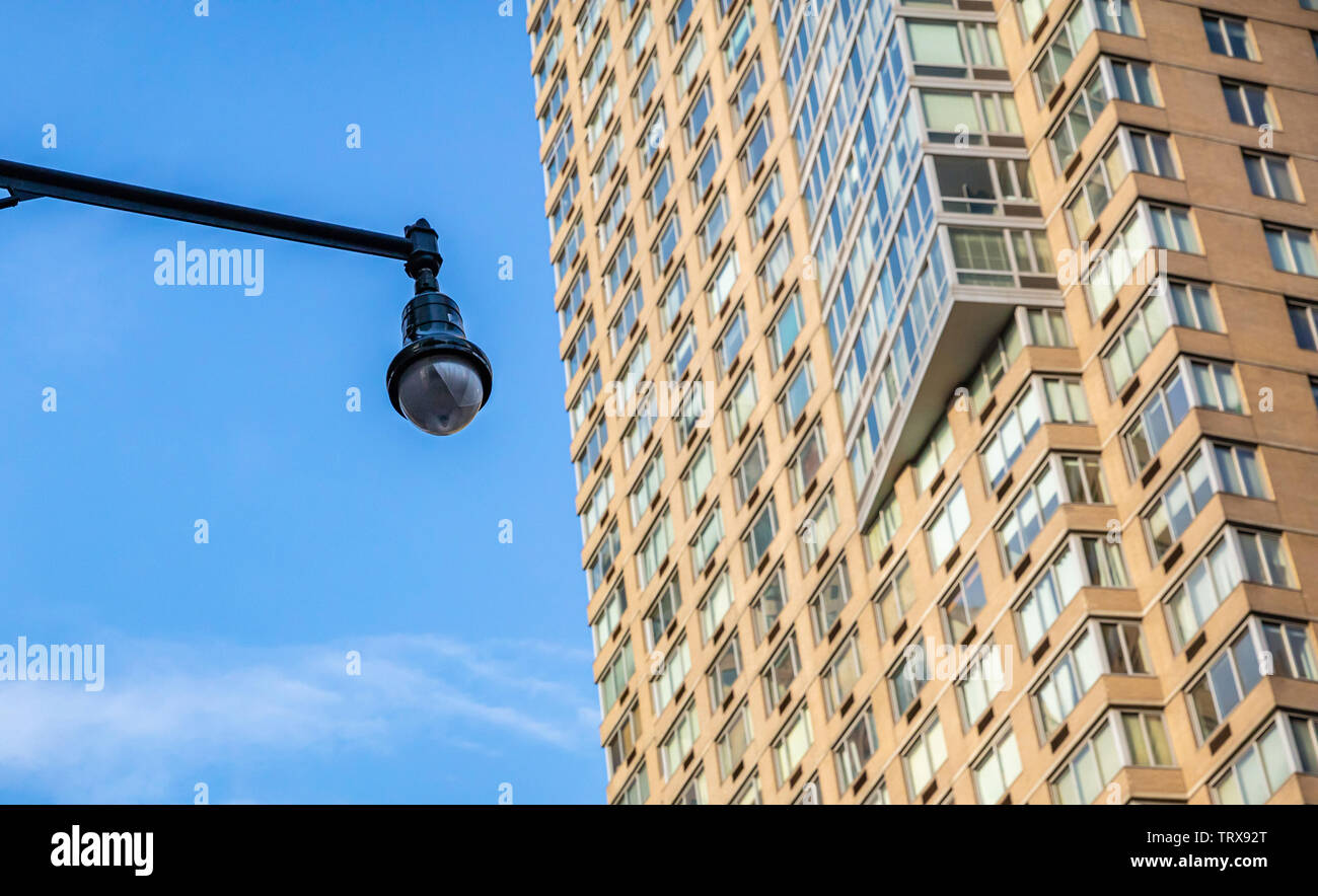 CCTV Security system. Surveillance Camera outdoors, skyscraper and blue sky background, low angle view Stock Photo
