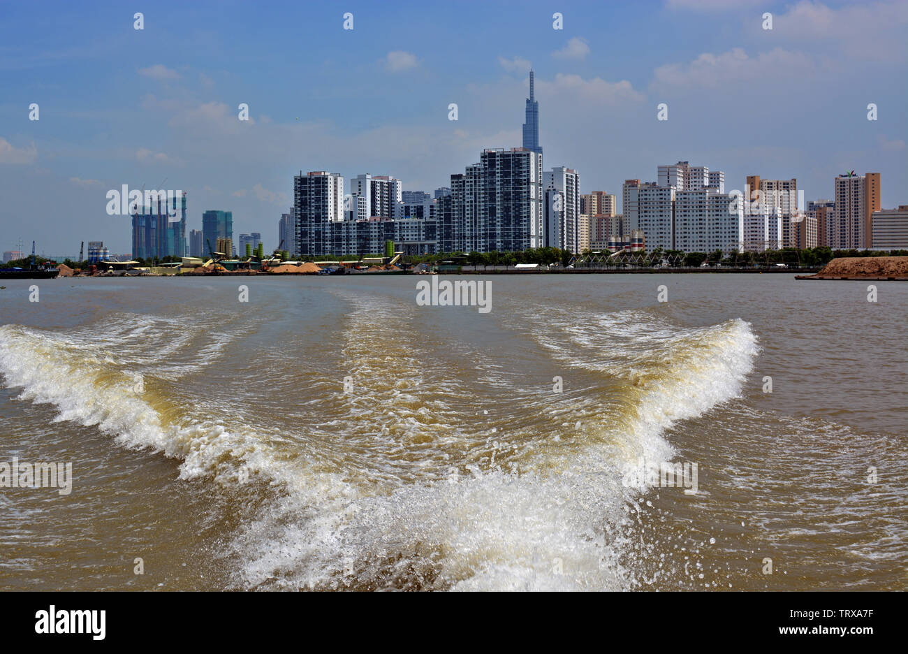 Panoramic View of Ho Chi Minh City District One from a boat on the Saigon River. Stock Photo