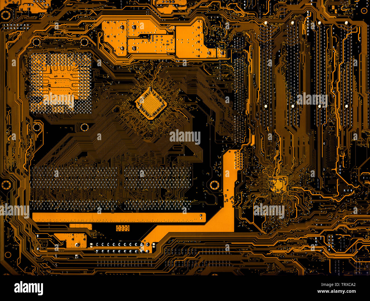 The reverse side of the motherboard of a personal computer close-up ...