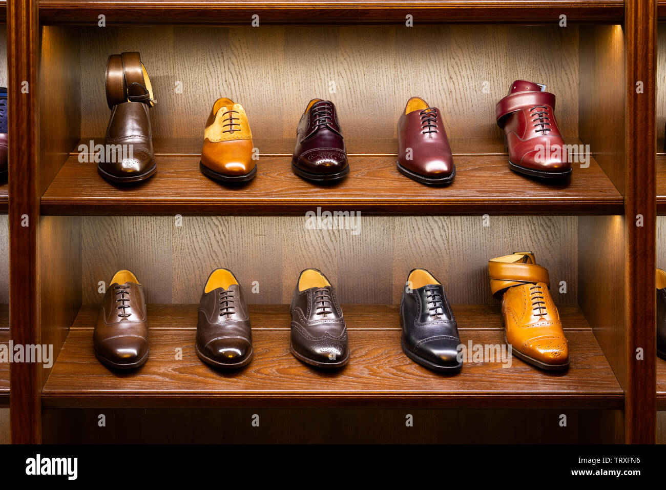 Full grain leather shoes on wooden display in men shoes boutique store.  Black, brown and other colors Stock Photo - Alamy