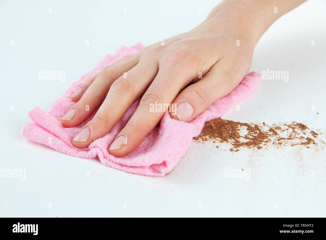 Hand wiping surface with pink rag isolated on white Stock Photo - Alamy