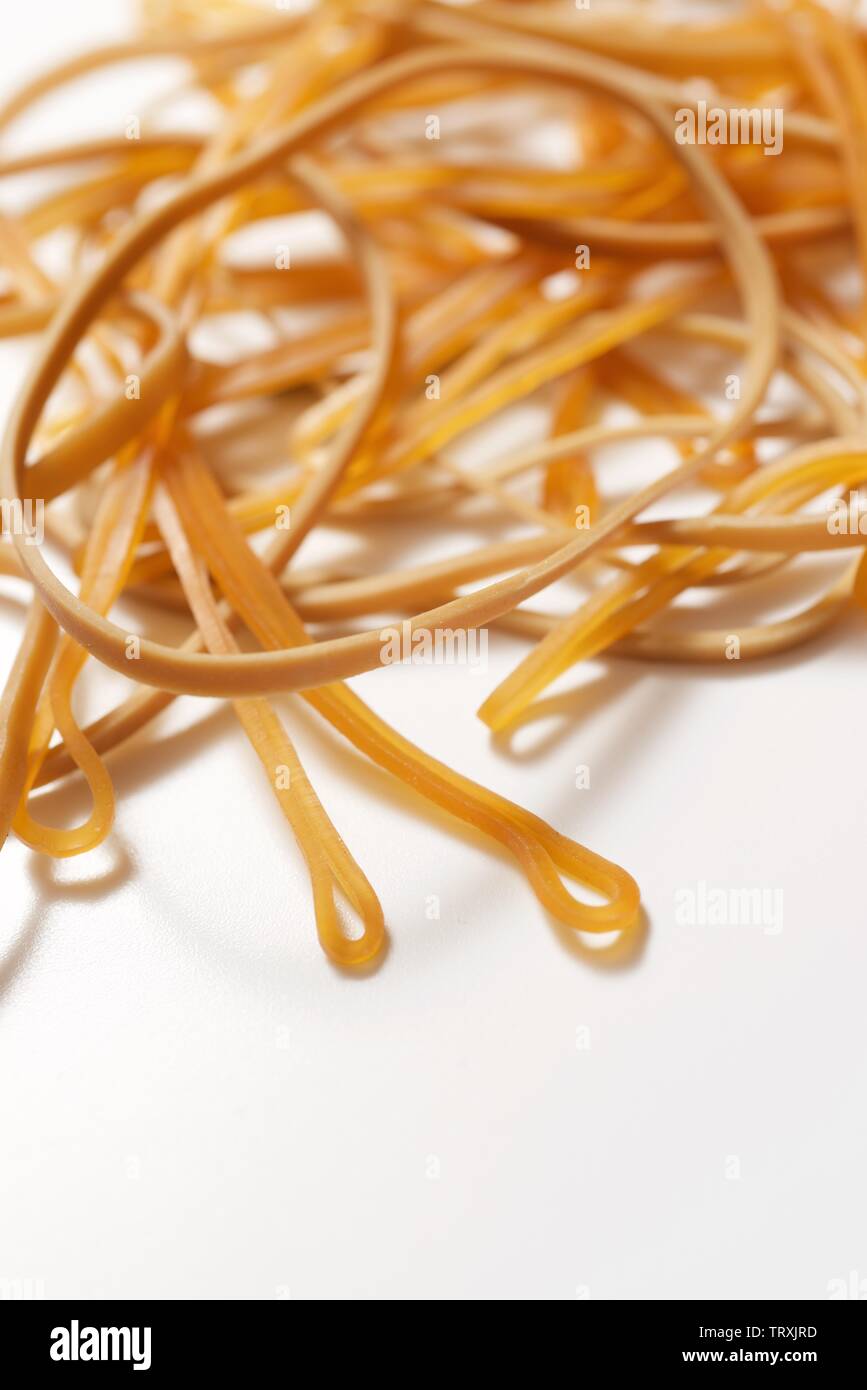 elastic rubber bands on a white table Stock Photo