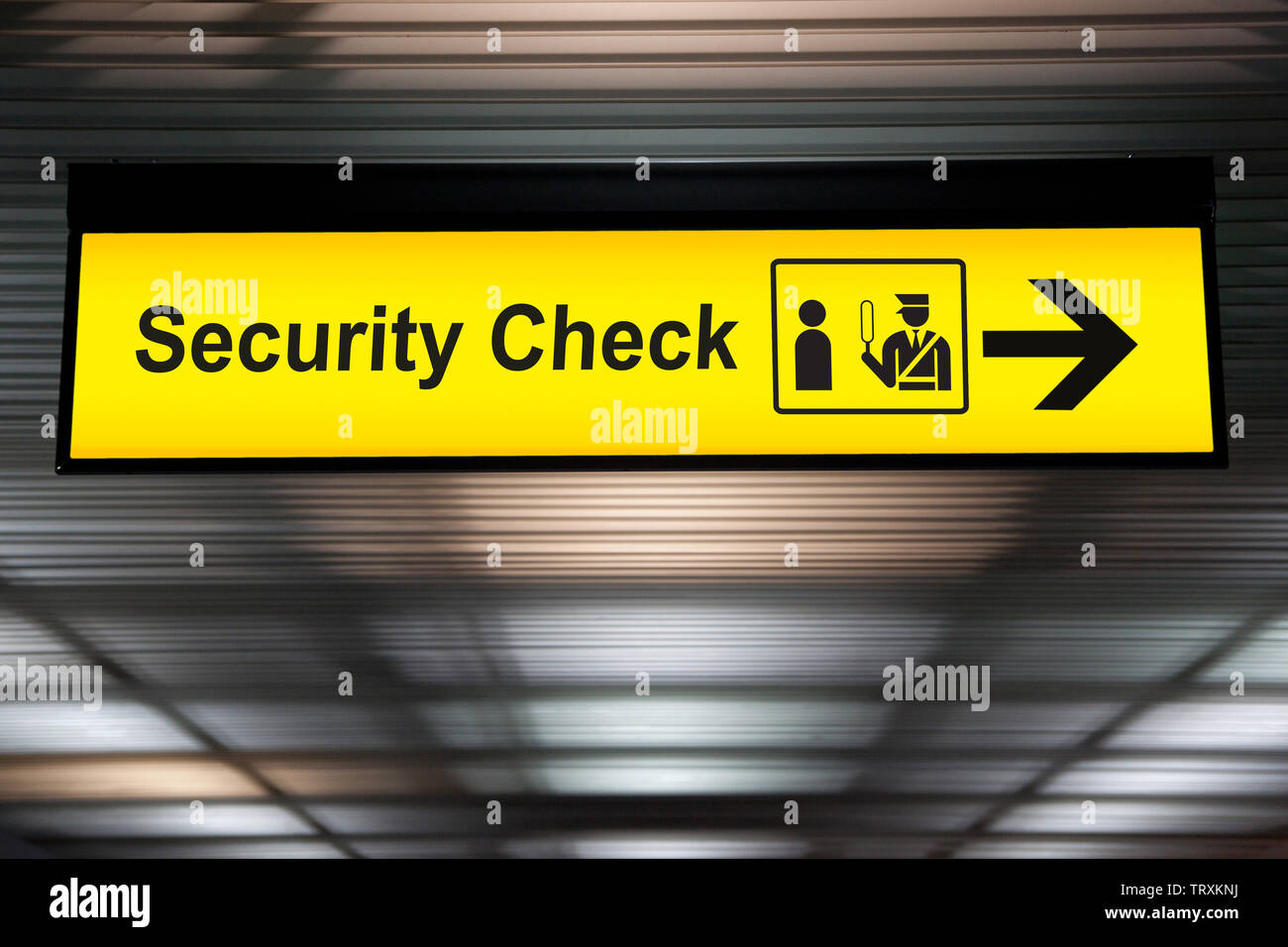 security check sign hanging from airport terminal ceiling Stock Photo