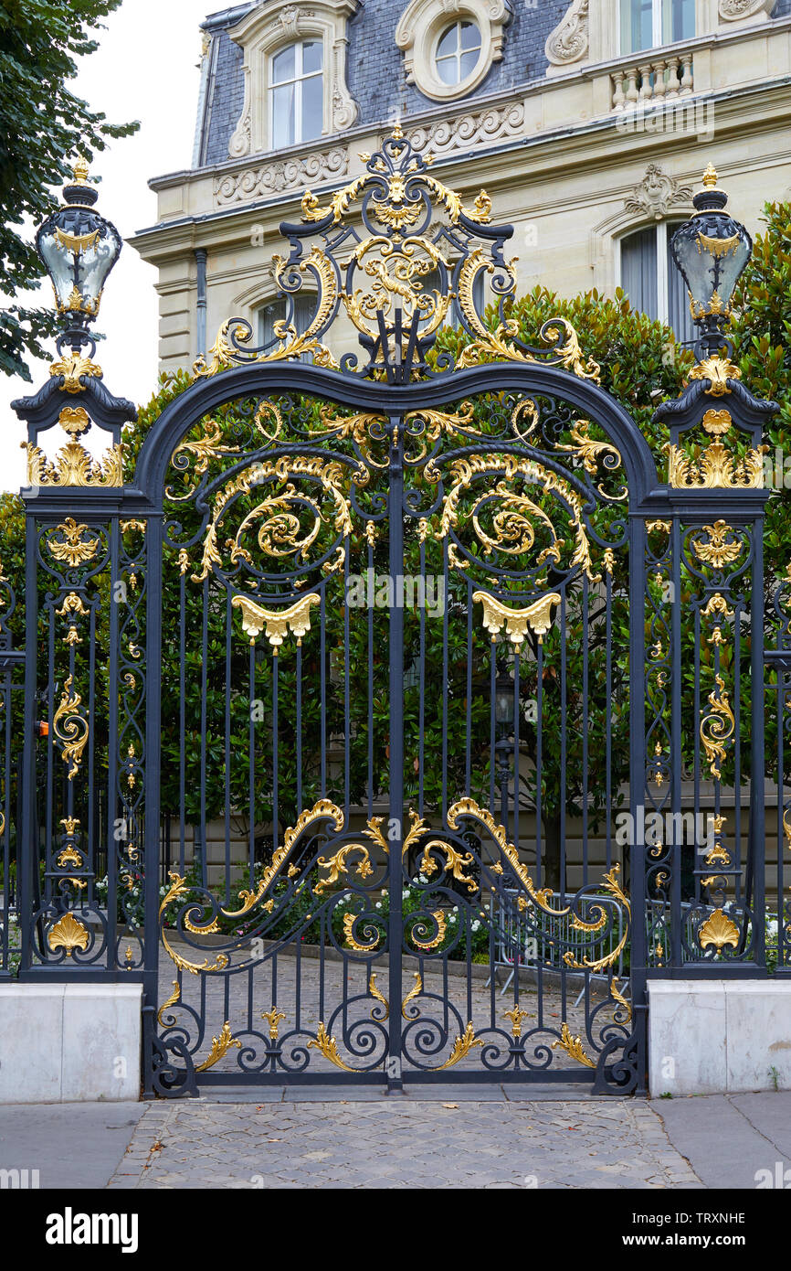 PARIS, FRANCE - JULY 22, 2017: Black and golden gate of Marcel Dassault building hosts Artcurial auction house in Paris, France Stock Photo